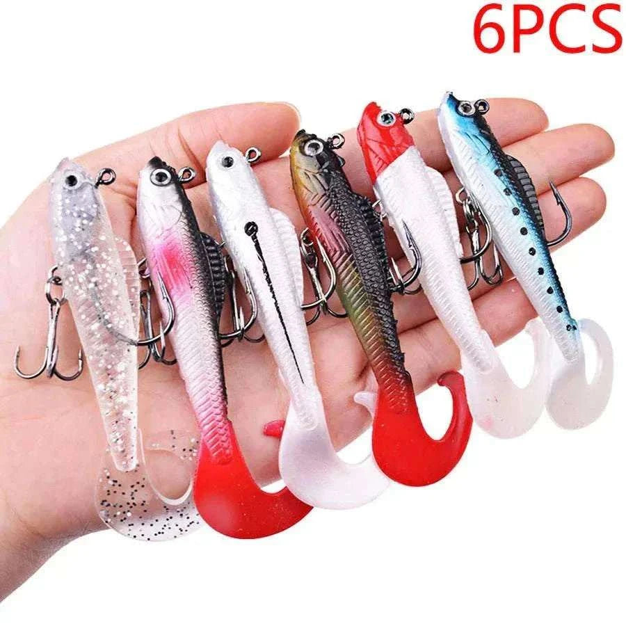 6-pack soft silicone wobbler fishing lures in six bright colors with 3D eyes and treble hooks for bass, pike, and carp