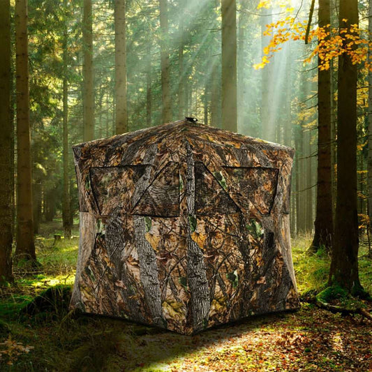Portable pop up ground hunting blind with camouflage, mesh windows, and tie downs for quick setup and stealth