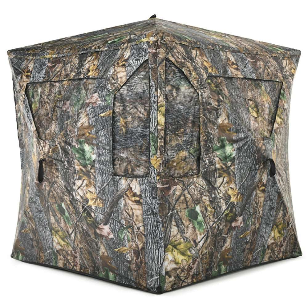 Portable pop-up ground hunting blind in jungle camouflage with mesh windows and tie downs for fast setup and stealth concealment.