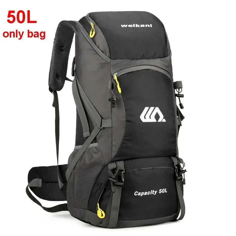 Waterproof outdoor travel backpack with 50L capacity and independent shoe compartment on hiking trail