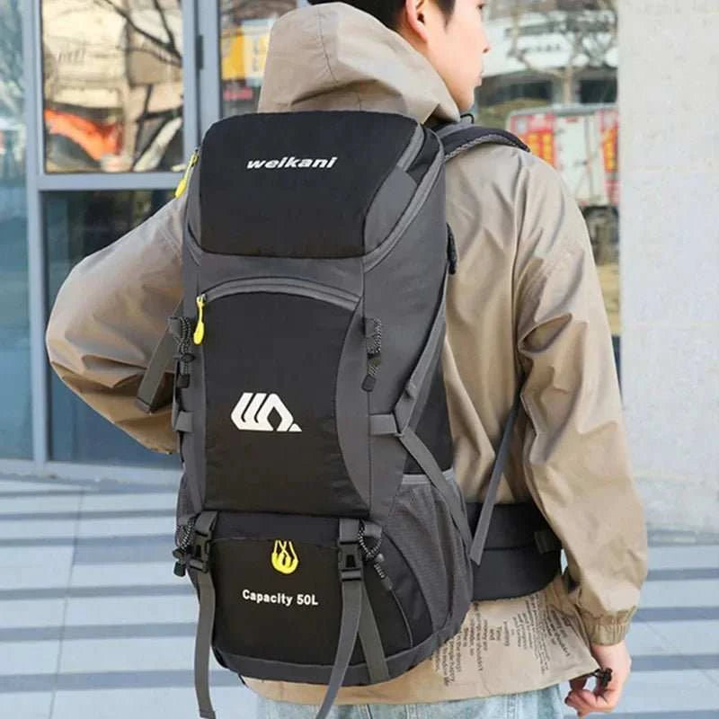 Waterproof outdoor travel backpack with 50L capacity and independent shoe compartment for hiking