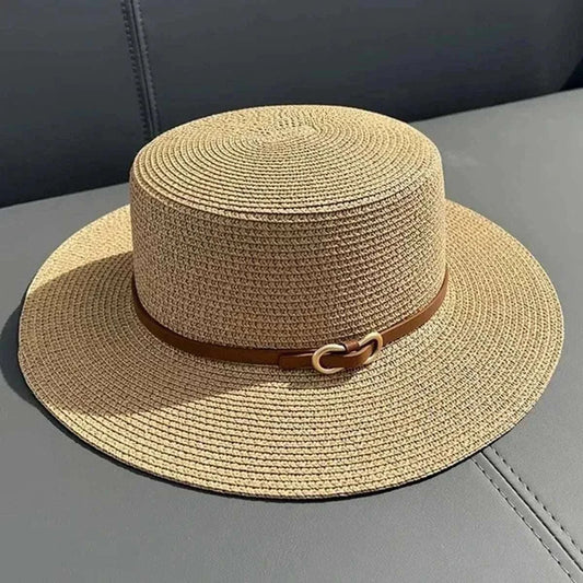 Straw sun hat for women with flat brim and bowknot detail, perfect for beach and summer outings