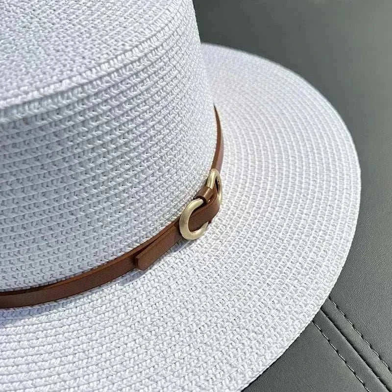 Straw sun hat with flat brim and bowknot detail for women at the beach
