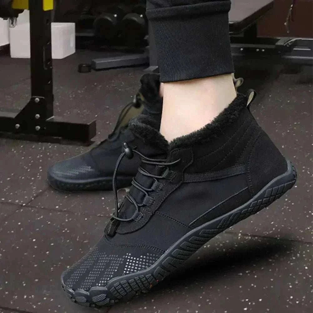 Unisex winter snow boots with plush lining and non-slip rubber soles on snowy terrain