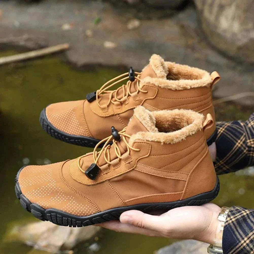 Pair of winter snow boots for men and women with lace-up closure, insulated lining, and anti-slip rubber soles for outdoor work and trekking