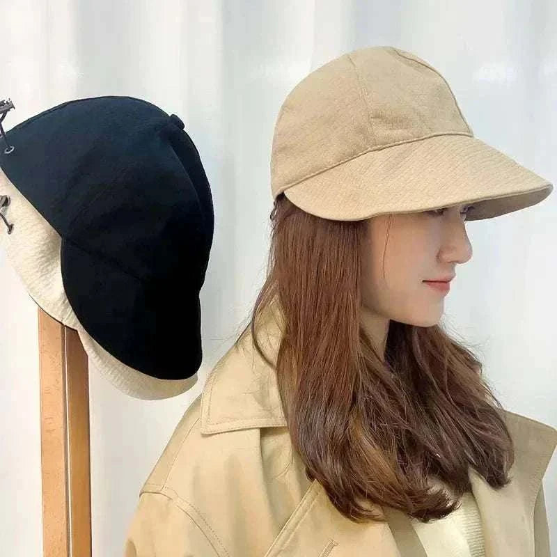 Women wearing foldable sun hat with wide brim for UV protection during outdoor hiking