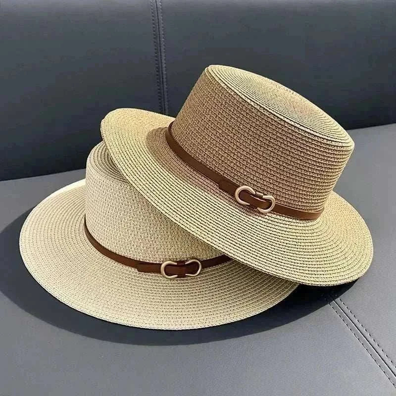 Women wearing a straw Panama sun hat with bowknot and flat brim at the beach